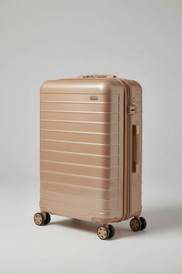 Voyager Carry-On Suitcase in Champagne Sand – Side angle