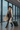 Female model travelling with Voyager Carry-On Suitcase in Forest Moss